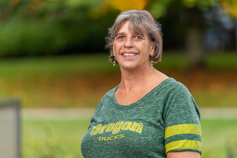 Thana Schafer wearing an Oregon Ducks green t-shirt